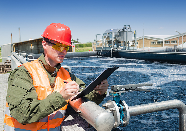 Worker at wastewater treatment facility.